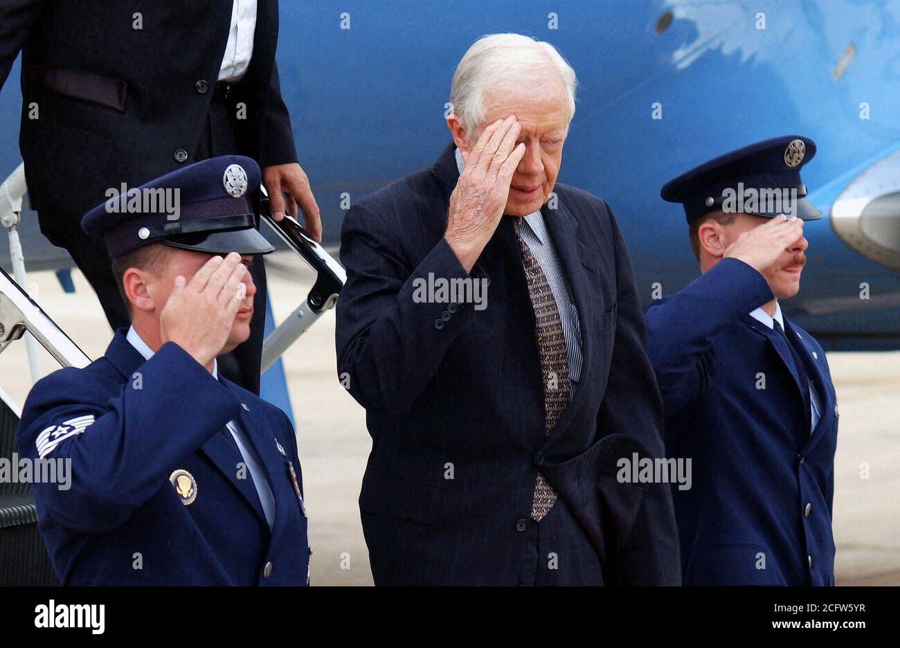 2001-former-us-president-james-e-carter-jr-renders-a-salute-upon-arriving-on-andrews-air-force...jpg