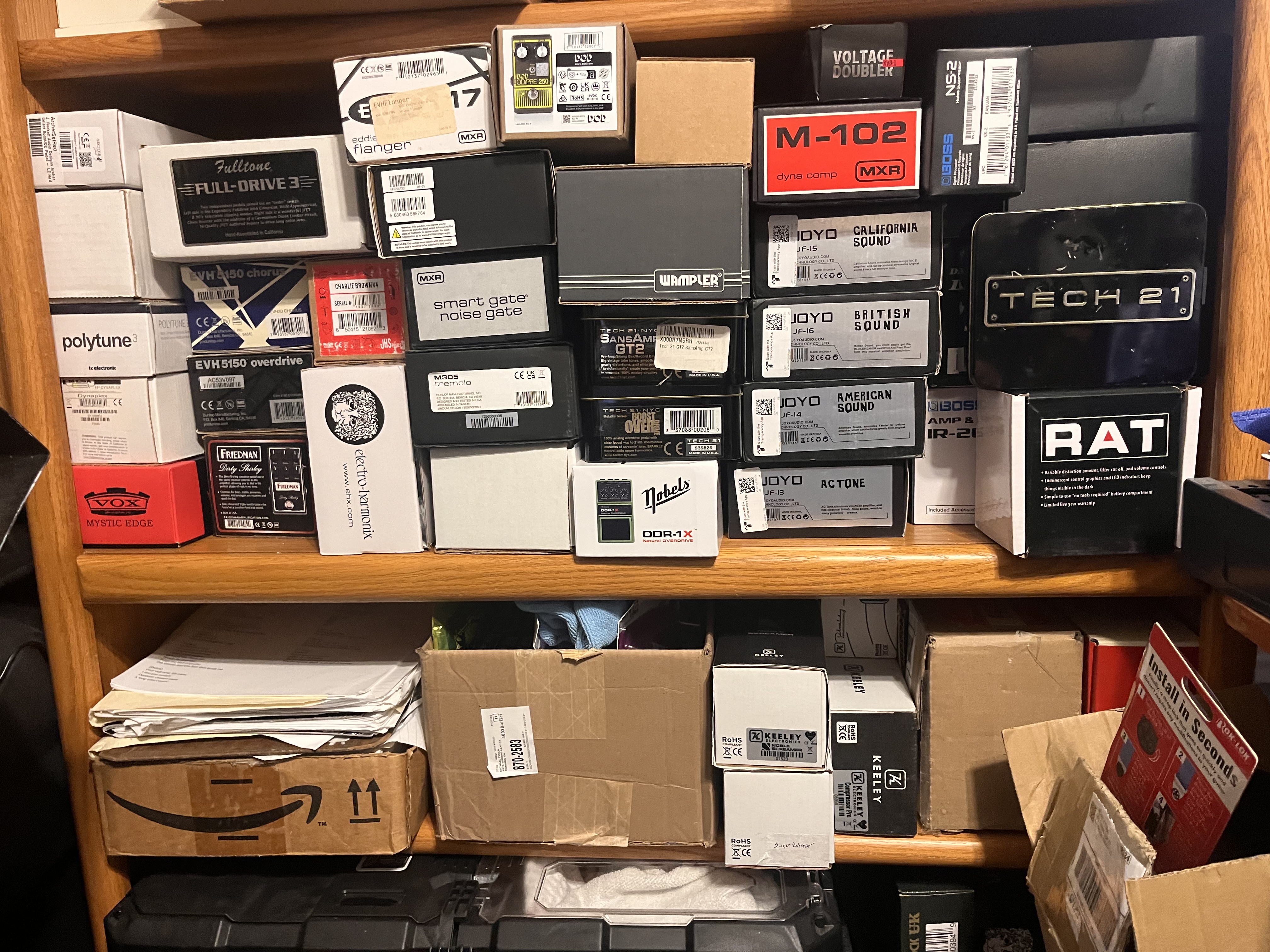 All my pedals on bookshelf.jpeg