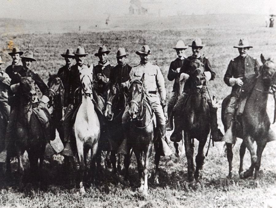 colonel-theodore-roosevelt-and-his-rough-riders-1st-volunteer-cavalry-1898-american-school.jpg