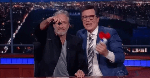 mic drop john stewart steven colbert.gif