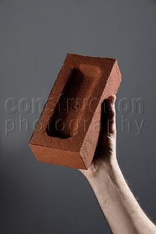 A194-00487_Male_hand_holding_a_brick.jpg